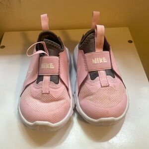 Pink Nike slip ons